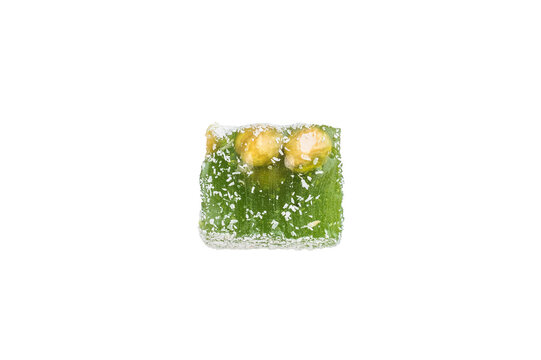 Chewy lokum dessert cubes with nut pieces and sugar coating. Colorful oriental style sweets isolated on clean white background.