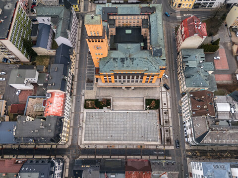 Top-down aerial view of the New Town Hall and Peace Square in Jablonec nad Nisou, Liberec Region, Czech Republic, surrounded by streets and rooftops.