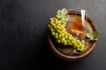 Fototapeta premium Seasonal grape harvest with a glass of pink wine