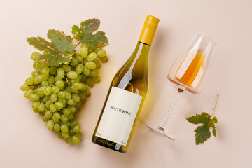 Fototapeta premium Festive white wine still life with vine leaf accents