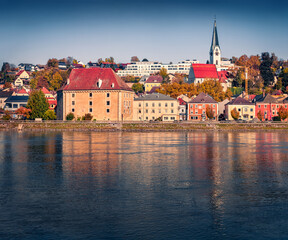 Amazing autumn view of old colorful buildings on the shore of Danube river. Sunny afternoon  cityscape of Mauthausen market town in state of Upper Austria, Europe. Traveling concept background. © Andrew Mayovskyy