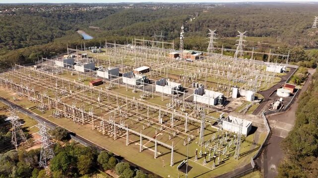 Aerial drone view of a large electrical distribution substation for the generation and supply of energy to households and industry located at Picnic Point in Sydney, NSW Australia  