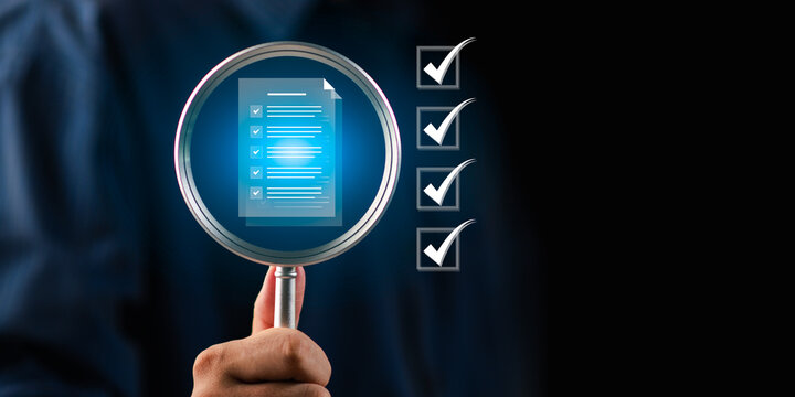 Quality auditor reviews checklist with magnifying glass for verification, inspection, quality control, compliance, audit, validation, accuracy, approval, process assessment in professional operations.