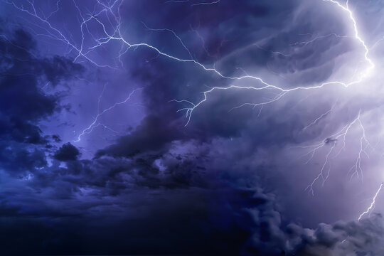 Dramatic Lightning Bolts Striking Across Dark Stormy Night Sky A stormy sky with lightning in the background