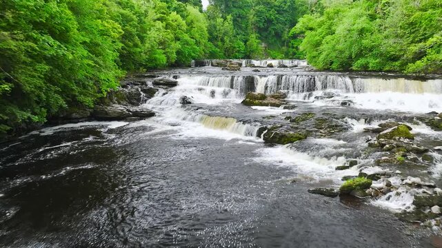 Aysgarth Falls on River Ure from a drone, Yorkshire Dales National Park, North Yorkshire, England, United Kingdom