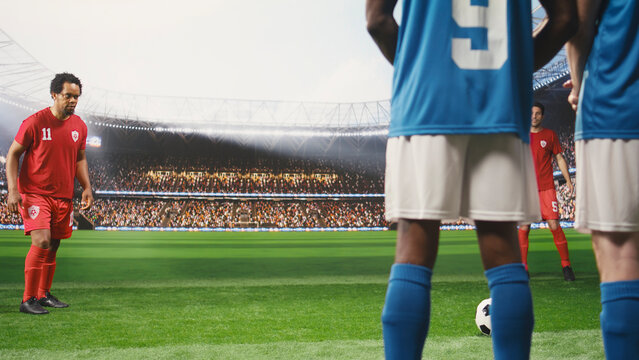 Soccer player taking free kick and advancing with ball