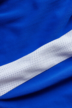Blue and white perforated sports fabric layers