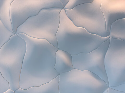 Abstract patterns on interior wall of office building lobby.
