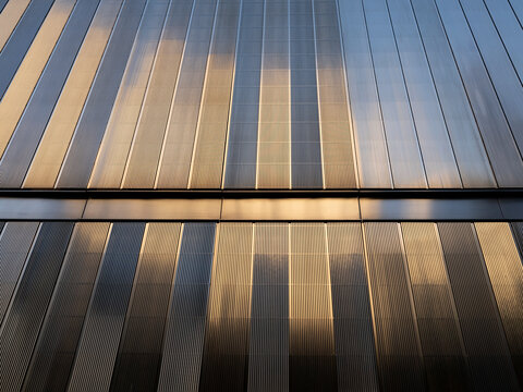 New York City, New York &ndash; October 3, 2026: Vertical metal louvers in sunlight and shadow on the facade of an office building in Lower Manhattan at the World Trade. Center.