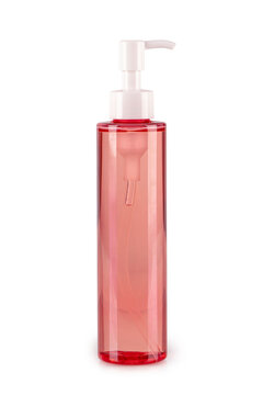 Cylindrical clear pink plastic bottle with a white pump dispenser. Perfect for beauty, cosmetic packaging, and skincare product mockups.
