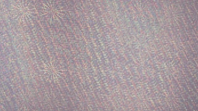 Abstract pattern of fine woven threads with subtle color shifts during soft lighting