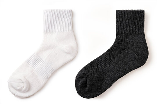 Top view of of comfortable white and black ankle socks.  textile apparel for sports and daily wear, fabric texture isolated on white background.