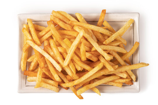 Flat lay shot of hot and crispy golden french fries served on a minimalist white plate. Professional food photography isolated on a white background for menus.