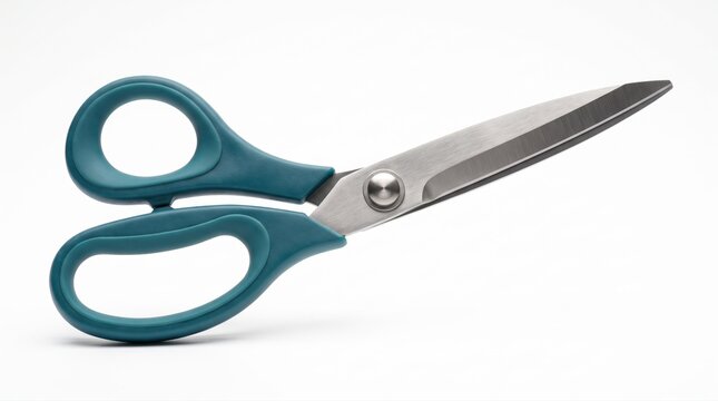 Pair of sharp metal scissors with green plastic handles for crafts