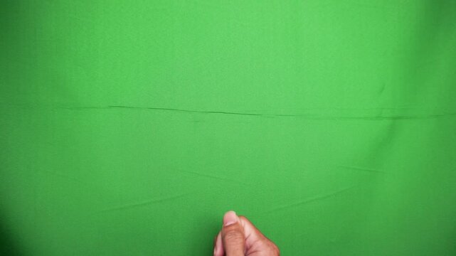 Hand Making Pull Down Dragging Gesture with Fist from Top to Bottom on Green Screen Chroma Key