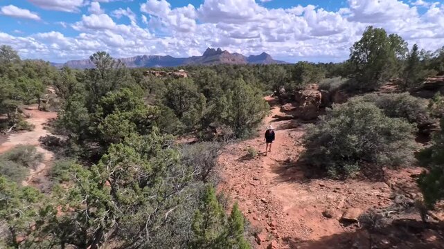 Senior woman gracefully hikes the scenic Gander Trail, surrounded by the beauty of Utah&rsquo;s Dixie National Forest and striking vistas.
