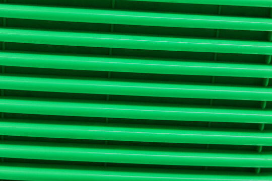 Green plastic texture with horizontal parallel lines