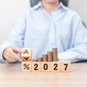 2027 New year with percentage change to UP and Down arrow with coin stack. Interest rate, GDP, stocks market, financial, deflation and Inflation, mortgage, debt, Loan and Economic Recession