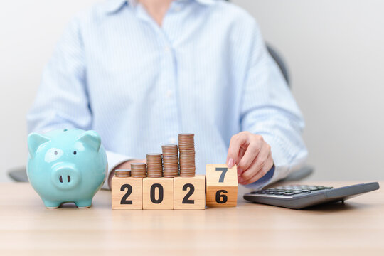 2026 end year to Happy New Year 2027 with piggy bank. Resolution, Goals, Plan, Action, Money Saving, Retirement fund, Pension, Investment and Financial concepts