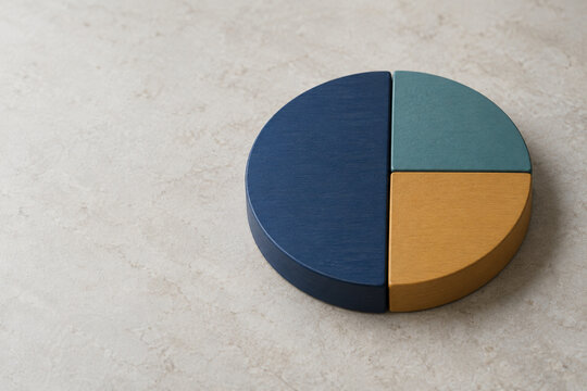 Wooden pie chart with three colored segments