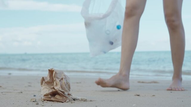 Save water. Volunteer pick up trash garbage at the beach and plastic bottles are difficult decompose prevent harm aquatic life. Earth, Environment, Greening planet, reduce global warming, Save world
