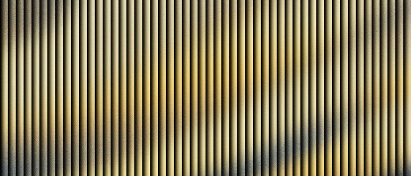 Golden metallic corrugated texture with vertical lines, industrial bronze ribbed surface pattern for architectural background, abstract metal grill with rhythmic shadows and shiny highlights.