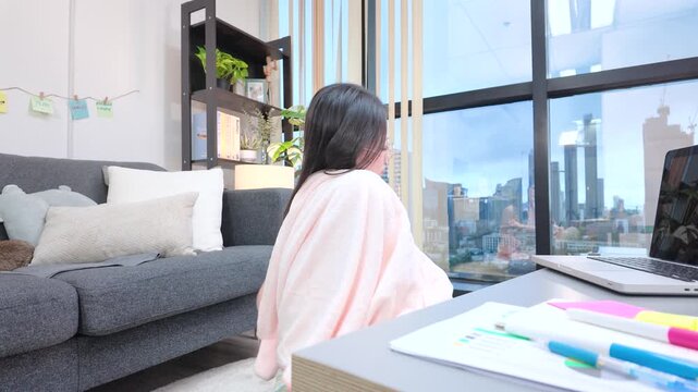 Tired Asian Woman Stretching at Desk While Working From Home