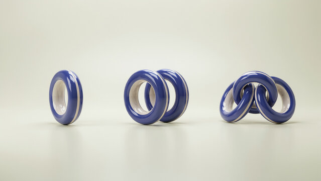 Three interlocking blue and white glossy ring sculptures on a neutral beige background