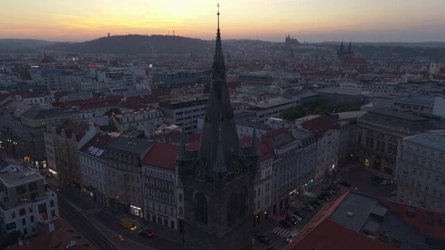 sunset flying clockwise around church spire in Prague