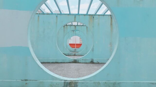 Lok Wah South Estate colorful pastel circle round spot for photography and tourist in Hong kong. Drone flying through the blue circle tunnel land. Asian travel journey, Asia landmark  concept.
