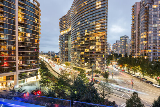 A skyline view of Vancouver residential condominium towers.  The corner of Smithe Street and Expo Boulevard narrows the Cambie Street bridge.  Yaletown, downtown Vancouver BC, Canada.