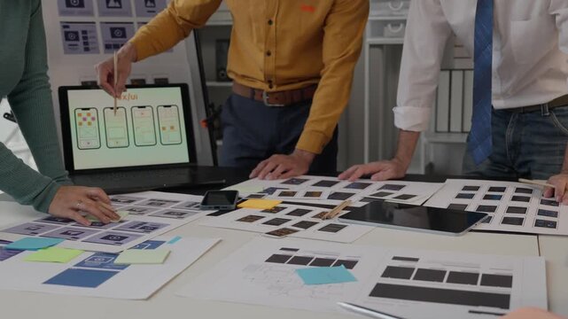 Ux ui designers collaborating on mobile application development