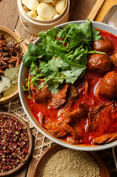 A close-up, top-down view of spicy beef ball noodles.