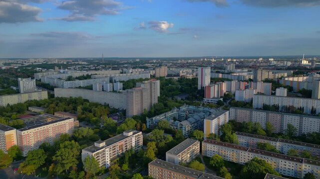 Sprawling urban landscape of residential prefabricated housing buildings, reflecting city planning and density. prefabricated housing. Nice aerial view drone panorama pan right