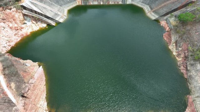 Betania Dam Spillway and Hydroelectric Infrastructure in Huila, Colombia. Establishing Shot. Aerial View.