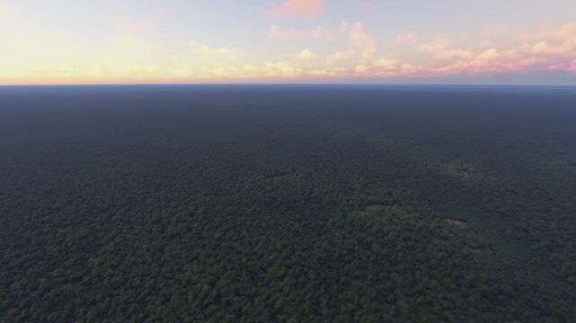 Circular aerial view at sunrise of R&iacute;o Mom&oacute;n in Amazon Rainforest. Loreto Region. Peru