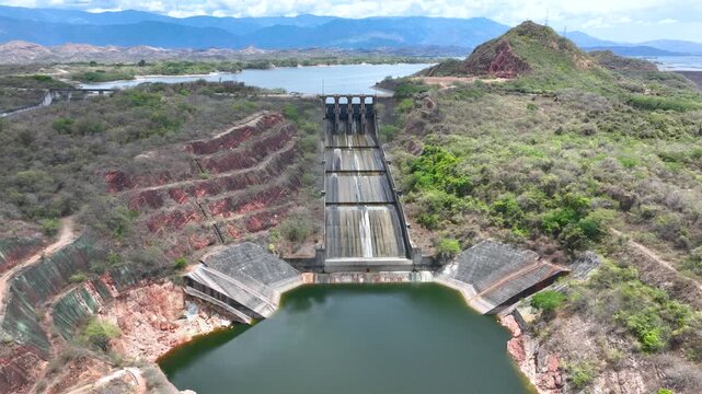Betania Dam Spillway and Hydroelectric Infrastructure in Huila, Colombia. Establishing Shot. Aerial View.