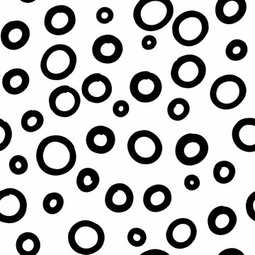 Hand-drawn scattered circles pattern, monochrome abstract, simple geometric texture.