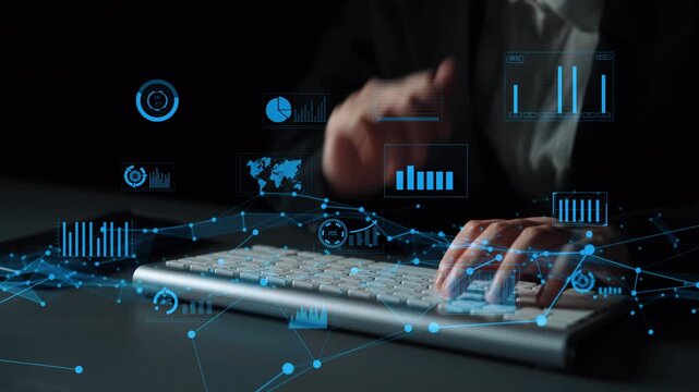 A professional uses a computer keyboard surrounded by digital charts and graphs, illustrating the concept of data analysis and technology in a modern workspace. Xenic
