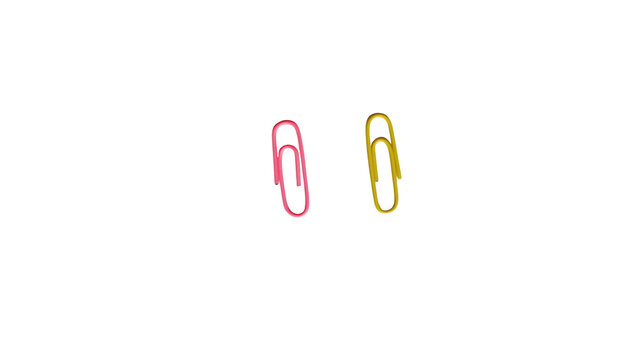 Pink and yellow paper clips isolated on white background