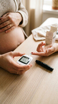 Pregnant Woman Testing Blood Sugar Level with Glucose Meter Gestational Diabetes