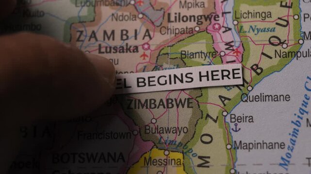 Travel Begins Here Text Strip Placed On Map Concept