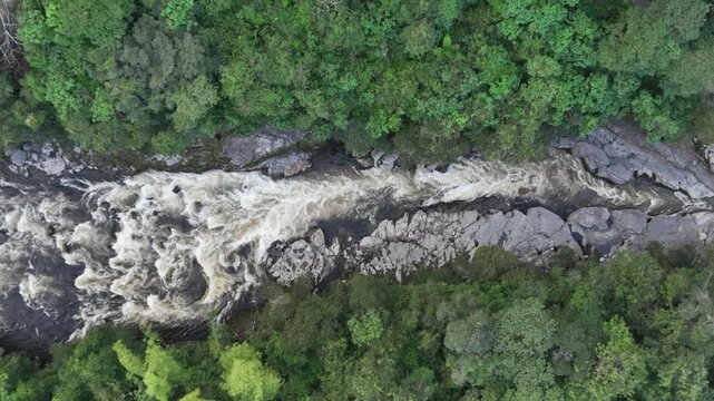 Betania Dam Spillway and Hydroelectric Infrastructure in Huila, Colombia. Establishing Shot. Aerial View.