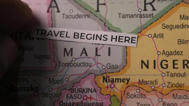 Travel Begins Here Label Placed on Africa Map Close Up