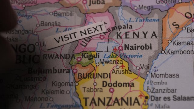 Visit Next paper tag on East Africa map travel destination concept close up