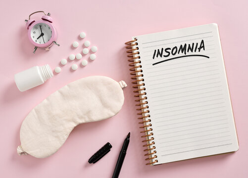 Insomnia notebook with alarm clock and sleeping pills