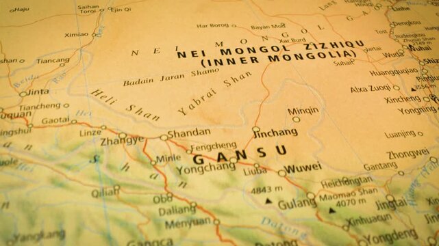 Smooth flyover toward Inner Mongolia, China &ndash; close-up view of physical atlas map