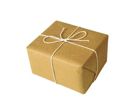 Small gift box wrapped in recycled brown craft paper tied with simple white twine string