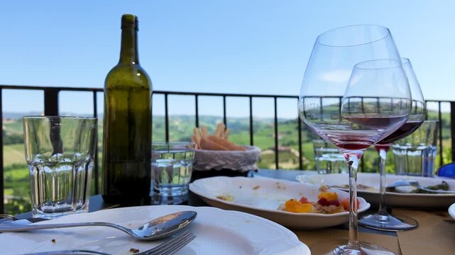 Red Wine and Lunch Table on Balcony Overlooking Vineyard Hills
