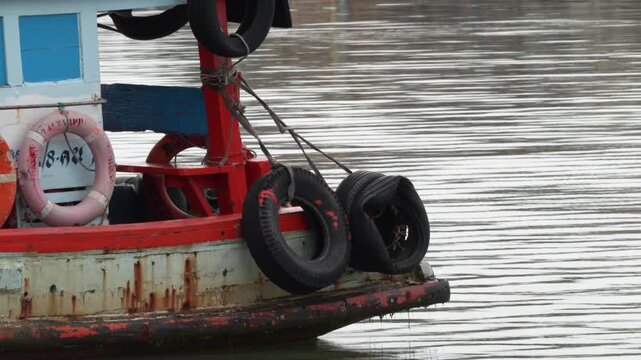 Stern of Wooden Fishing Boat Moored in River Harbor